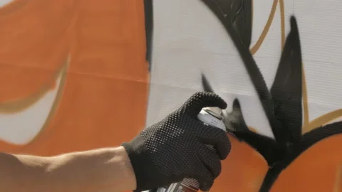 Draws graffiti paint from the container Stock Footage 114295218