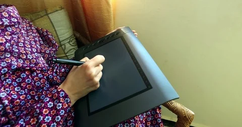 Draws on a graphic tablet  Stock Footage 76787205