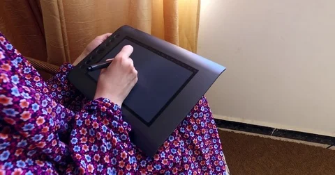 Draws on a graphic tablet Stock Footage 76787506