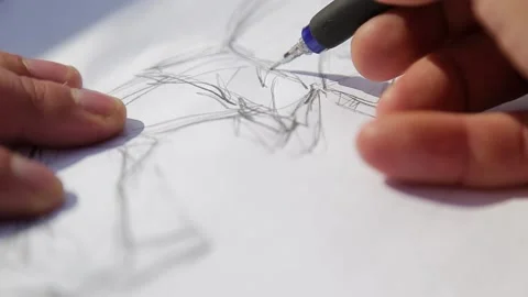 Draws a sketch on paper Stock Footage 131615600