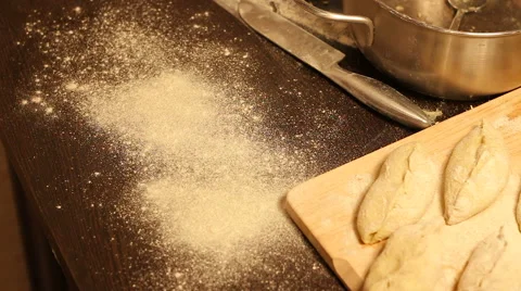 Draws a smiley on the flour on table for baking Stock Footage 57354726
