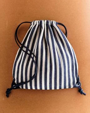 Drawstring backpack on brown eco background Stock Photos