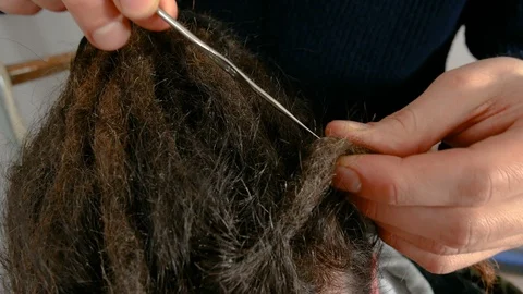 A dreadlocks man  puts in order his dreads Video stock 86404502