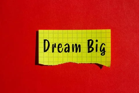 Dream Big message written on ripped torn paper background. Conceptual Dream.. Stock Photos