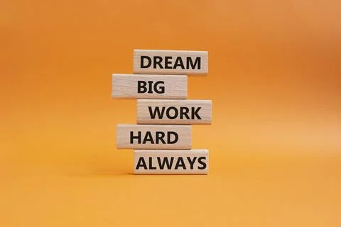 DREAM BIG WORK HARD symbol. Wooden blocks with words DREAM BIG WORK HARD AL.. Stock Photos