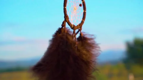 Dream Catcher Hanging From Rear view Mirror Inside Car waving in the wind Stock Footage 150573016