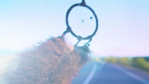 Dream Catcher Hanging From Rear view Mirror Inside Car waving in the wind Video stock 150573143