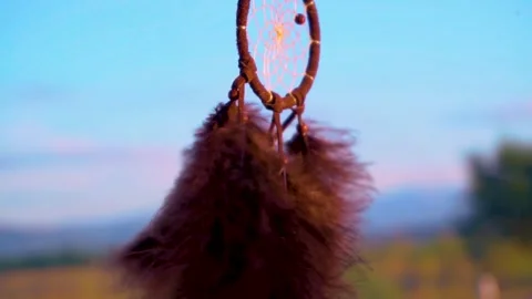Dream Catcher Hanging From Rear view Mirror Inside Car waving in the wind Stock Footage 150573177