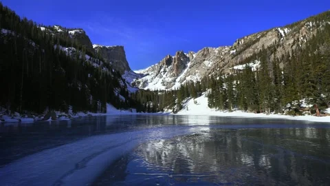 Dream Lake Winter cobalt deep blue ice Rocky Mountain National Park RMNP Stock Footage 329802933
