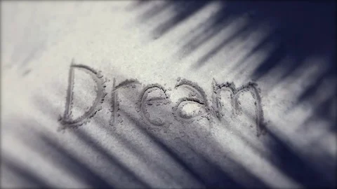 Dream Message Handwritten in Sand with Shadows Stock Footage