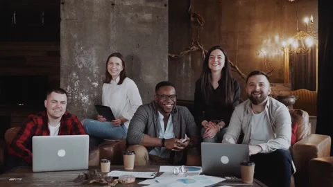 Dream team of casually dressed designers drafting together cooperating in good Video stock 131674807