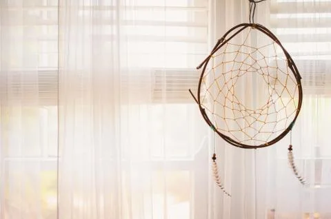 Dreamcatcher in window Stock Photos