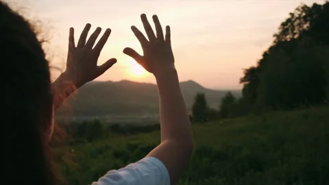 Dreaming child pulls hands to sun. Religion helping hands Stock Footage 311990696