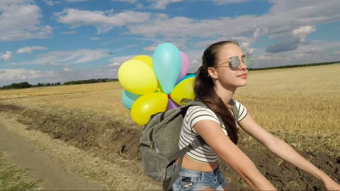 Dreaming girl with balloons Stock Footage