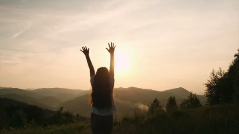Dreaming kid outstretching arms up on background mountains Stock Footage 311991889