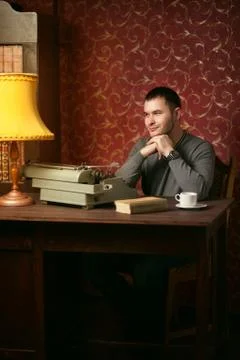 Dreaming writer with typewriter Stock Photos