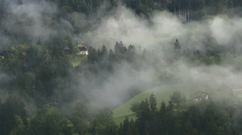 Dreamlike mountain covered with light sunlit mist Video stock 67219162