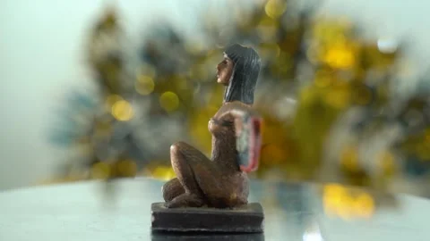 Dreamy close-up shot of a Cleopatra statue with wide open wings, shiny Stock Footage 259638975