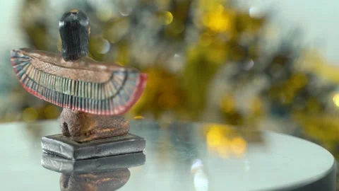 Dreamy close-up shot of a Cleopatra statue with wide open wings, hazy Stock Footage 259639009