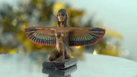 Dreamy close-up shot of a Cleopatra statue with wide open wings, hazy Stock Footage 259639028