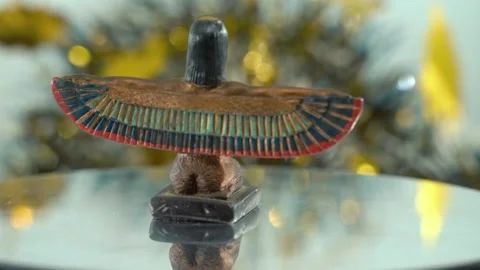 Dreamy close-up shot of a Cleopatra statue with wide open wings, hazy Stock Footage 259639033