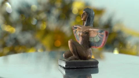 Dreamy close-up shot of a Cleopatra statue with wide open wings, shiny Stock Footage 259639048