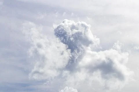 Dreamy cloud formations stretching across vibrant blue tropical atmosphere .. 스톡 사진