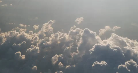 Dreamy clouds cumulus backlit by sun light, top view perspective. Meteorology Stock Footage 159236816