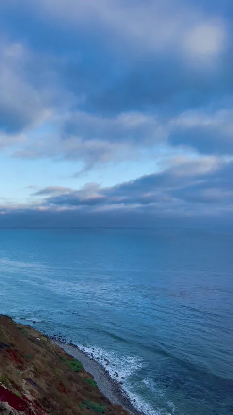 Dreamy Clouds Roll In Over the Deep Blue Sea Pacific Ocean in California Stock Footage 244458955