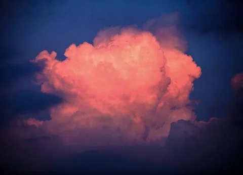 Dreamy clouds at sunset Stock Photos