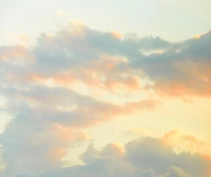 Dreamy clouds at sunset Stock Photos