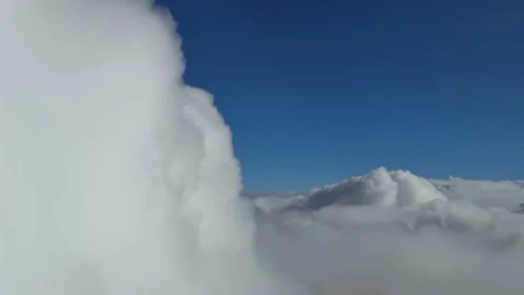 Dreamy Cloudscape Flying Through an Endless Sea of Stratus Clouds in a Blue Vídeos de archivo 325023240