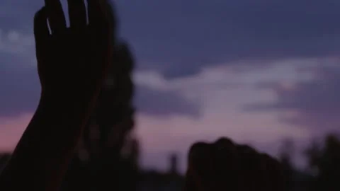 Dreamy hands dancing in the sunset Stock Footage 135457972