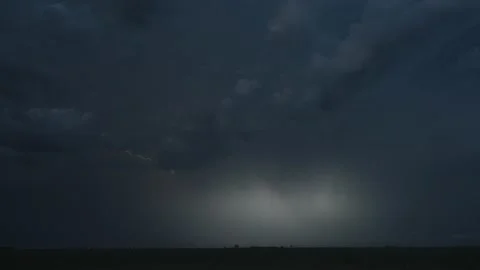 Dreamy Lightning Flickers and Dances Across the Dark Sky. Stock Footage 233065709