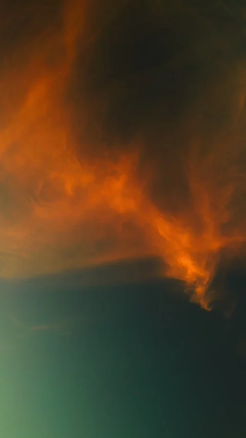 Dreamy orange cloud in the turquoise sky at sunset Stock Footage 250525404