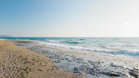 Dreamy Slow Motion Beach Waves - 4K Serene Daytime Ocean Stock Footage 304760633