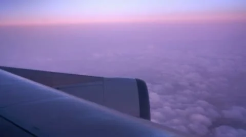 Dreamy sunset clouds from a jet Stock Footage 10713742