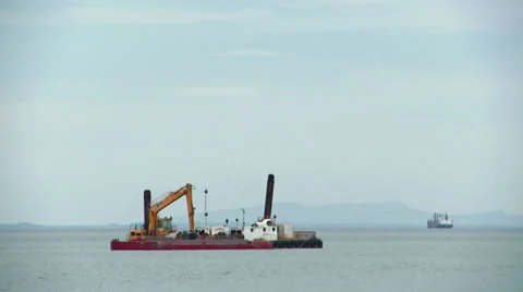 Dredge and ship leaving timelapse Stock Footage 32143950