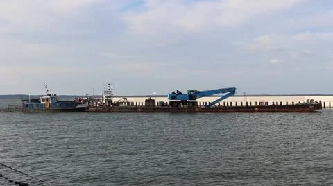 Dredge on a barge in the harbor Stock Footage 42969188