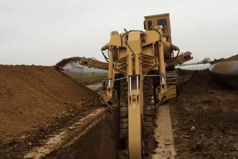 Dredger with bar worker mining on cutting machines Stock Photos