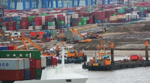 Dredger, container terminal, tip truck and container ship on the Elbe Stock Footage 67674095