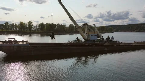 A dredger dumps sand from the bottom of the river Stock Footage 142073883
