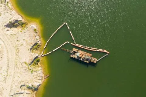 Dredger in the quarry for sand mining. Stock Photos