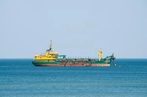Dredger ship working at sea Stock Photos