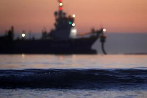A dredger supplying sand to a beach Stock Photos