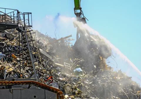 Dredger is working on a scrap yard Stock Photos