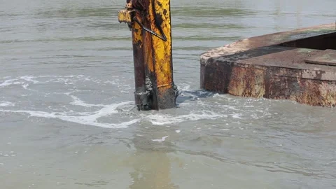 Dredging the bottom of water area, view of the bucket of the floating excavator Video stock 274943848