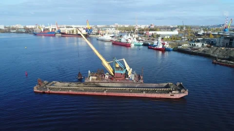 A dredging machine takes sand from the bottom of the river and loads to barge. Stock Footage 231076155