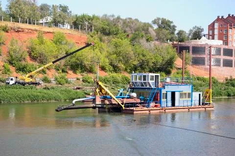 Dredging operations on a river Stock Photos