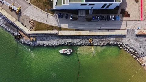 Dredging process along the harbor coastline Stock Footage 338187129